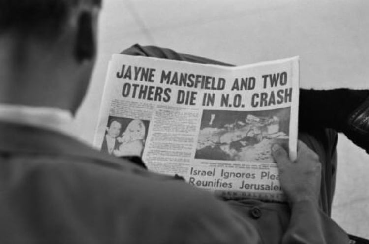 A man in New Orleans reads about the death of American actress Jayne Mansfield in a car crash outside the city the previous day, USA, 30th June 1967.