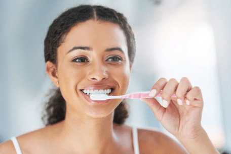 How to Keep Your Teeth Shining White Despite Drinking Caffeinated Drinks - Brushing | Bornfertilelady.com